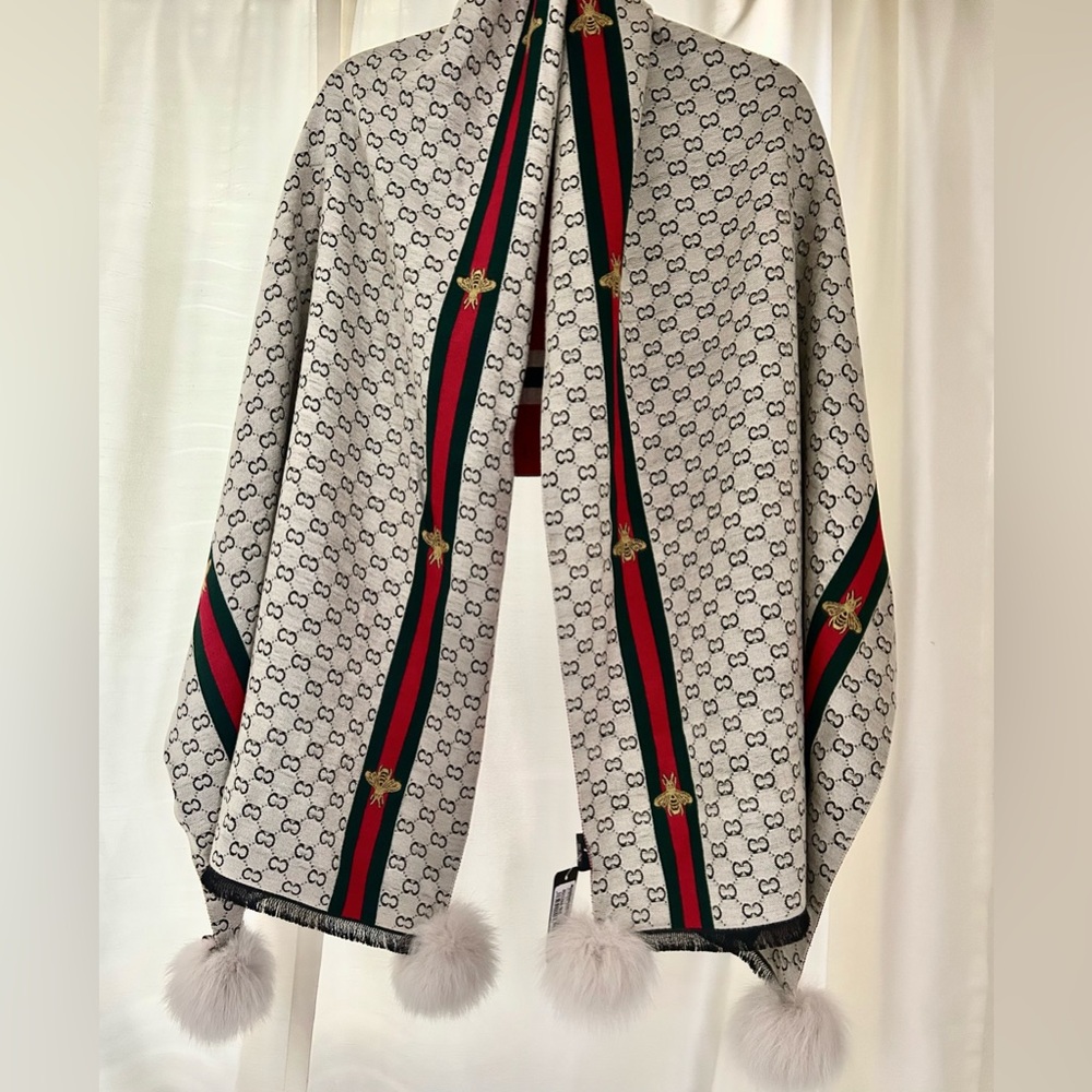 Mitchies oversized scarf with natural pom poms.